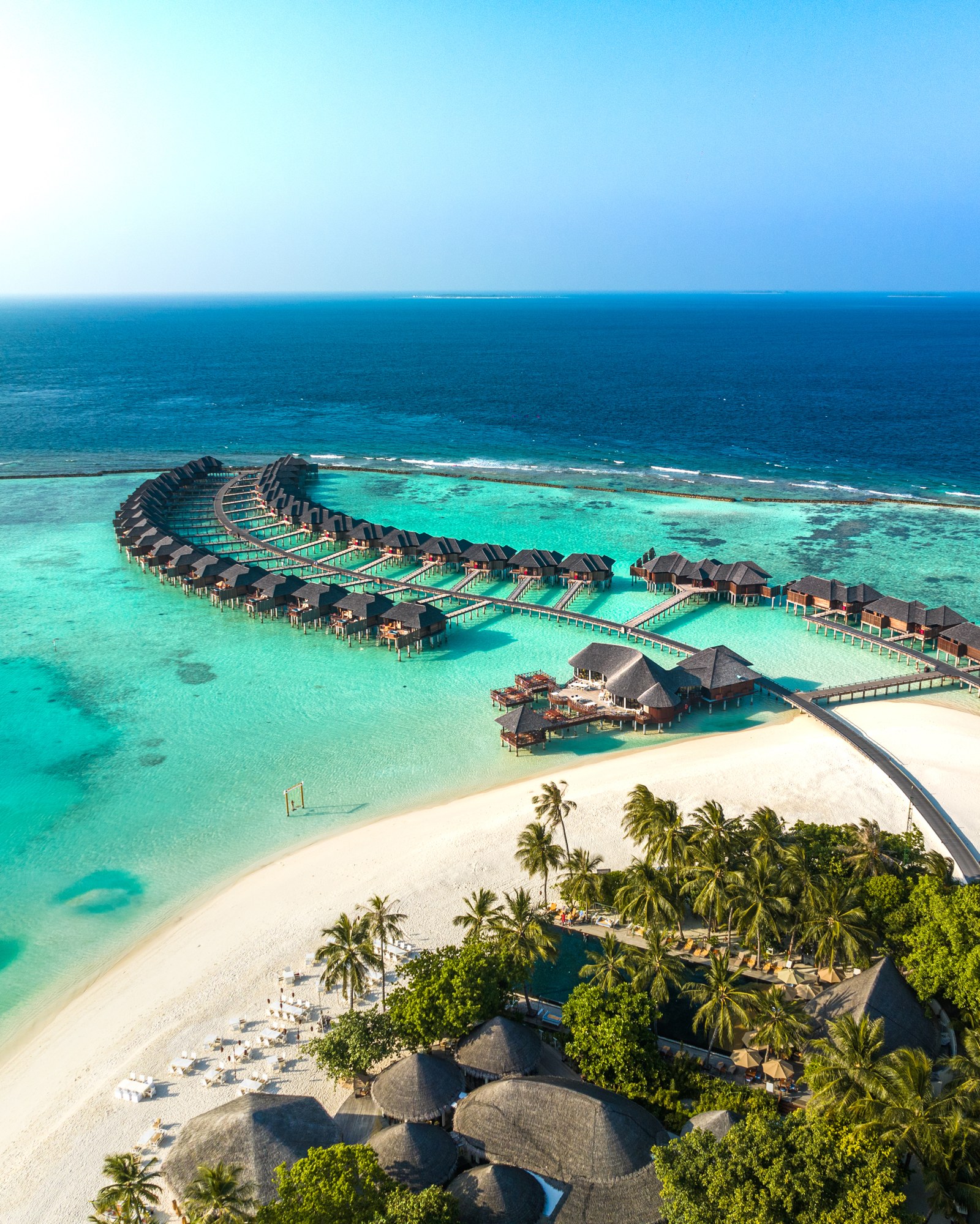 Aerial photograph of turquoise lagoon and overwater villas from our NabitPhotos portfolio